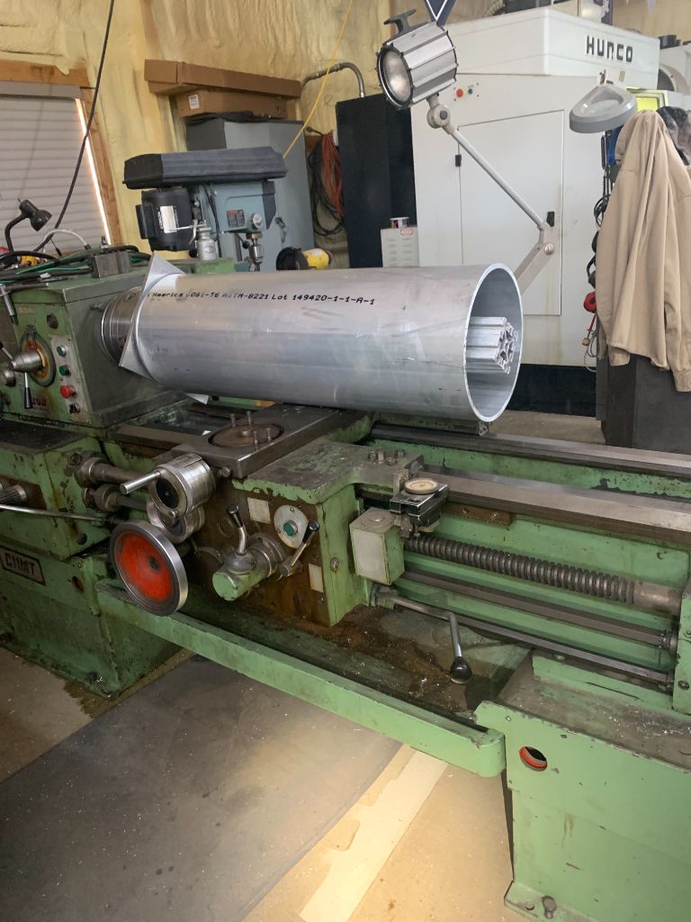 Custom lathe-turned aluminum tube with internal machining and specifications marked