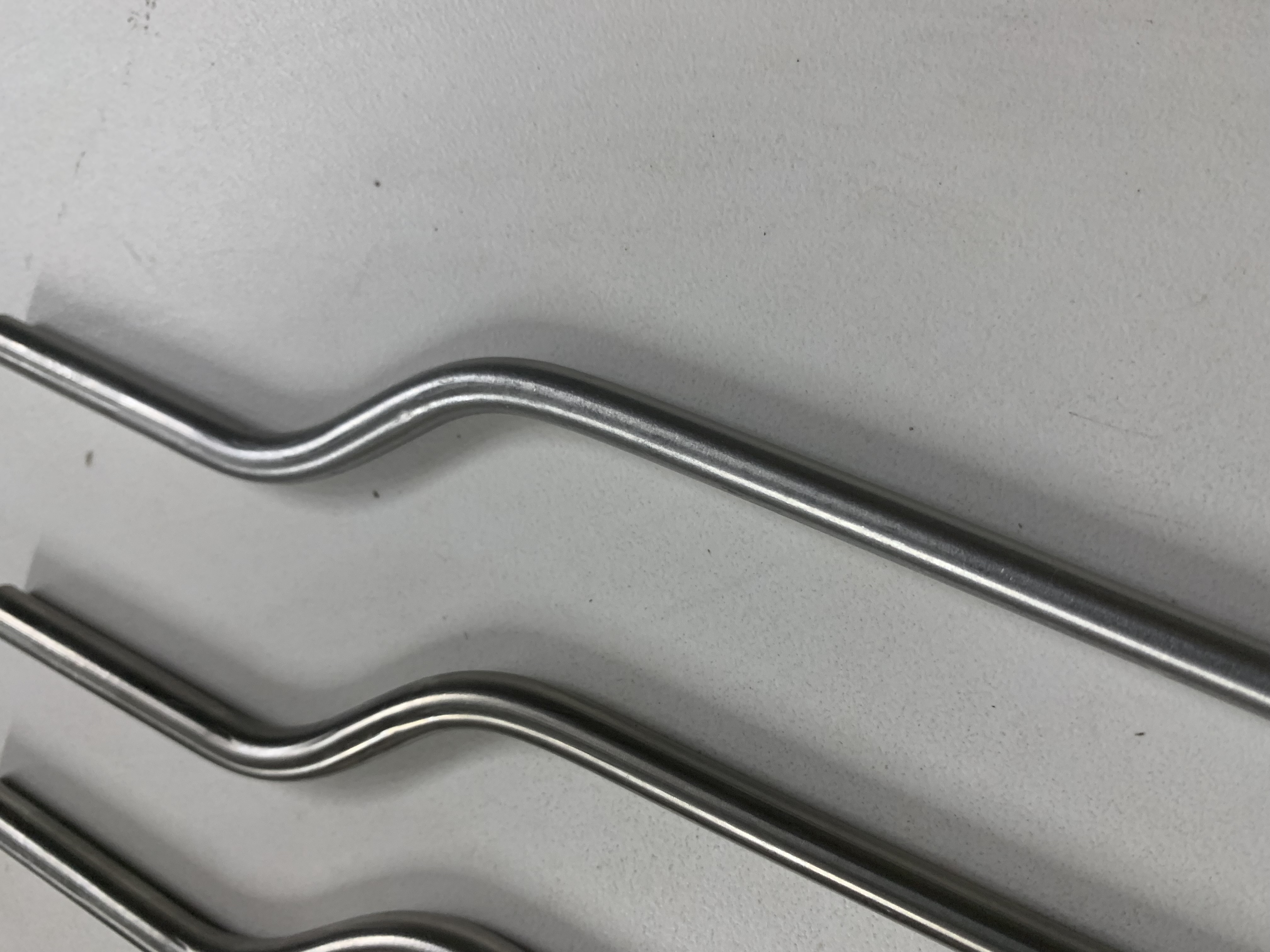 Three precision bent metallic rods - tube bending examples